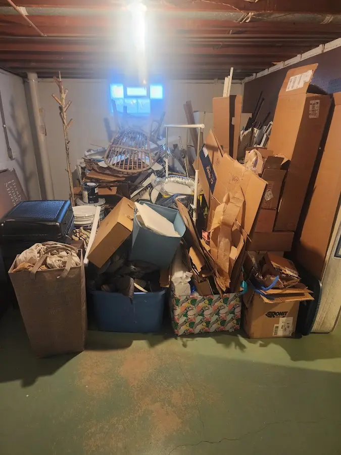 Roll-off dumpster container at job site for 4 Yard Dumpster Rental in Thompson